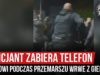 Policjant zabiera telefon kibicowi podczas przemarszu WRWE z GieKSy (12.10.2019 r.)